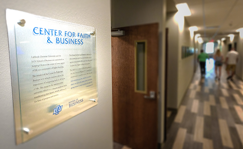 Center for Faith and business plaque in a hallway