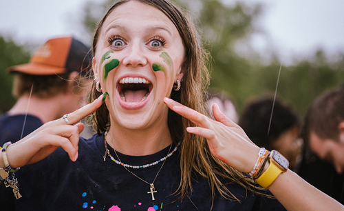 Girl smiling with paint on her face