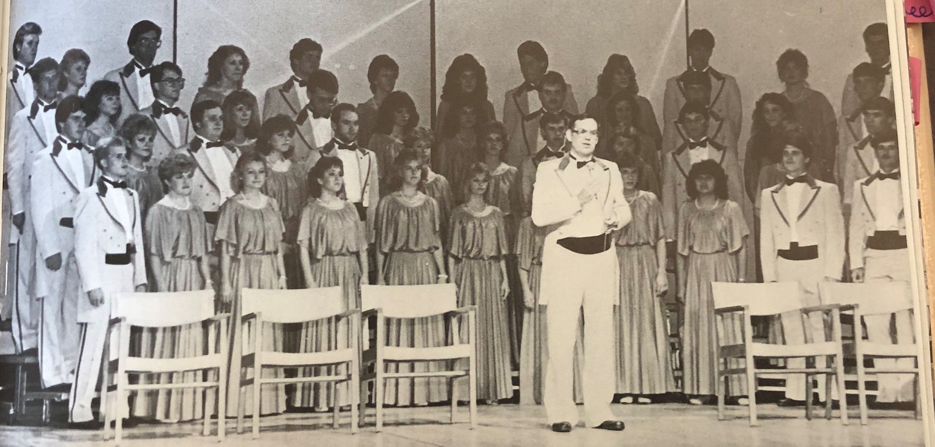 an old scanned black-and-white photo of a performing choir