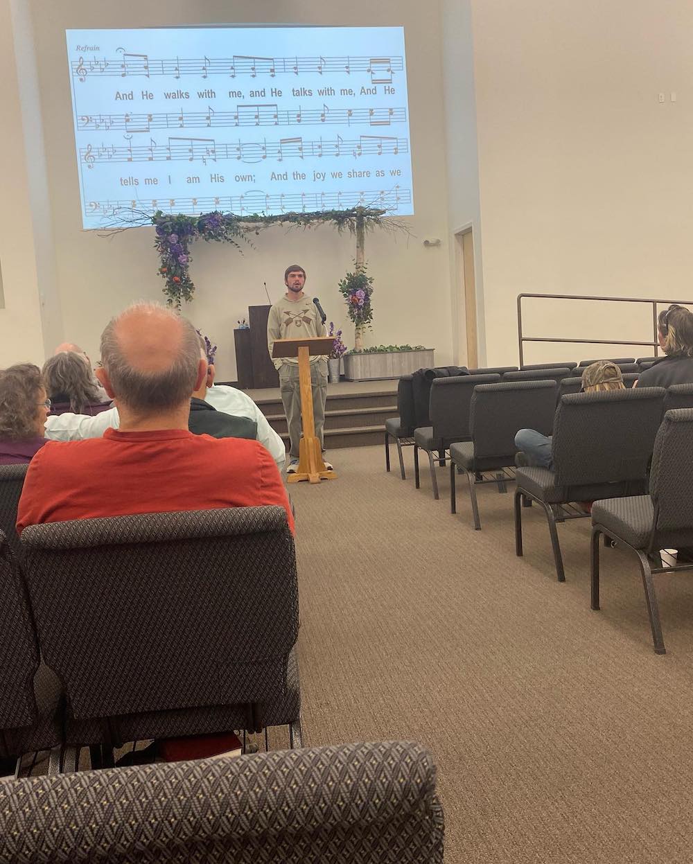 an LCU student leading singing in a small congregation in Alaska