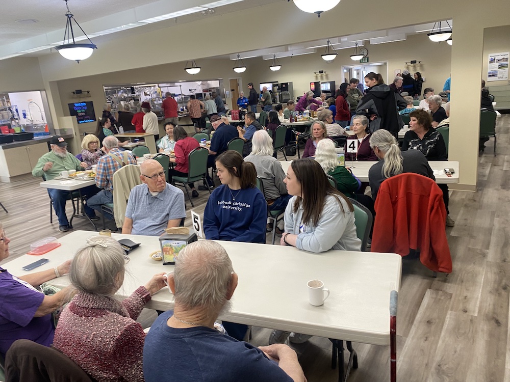 LCU students sharing lunch with residents of a retirement village.