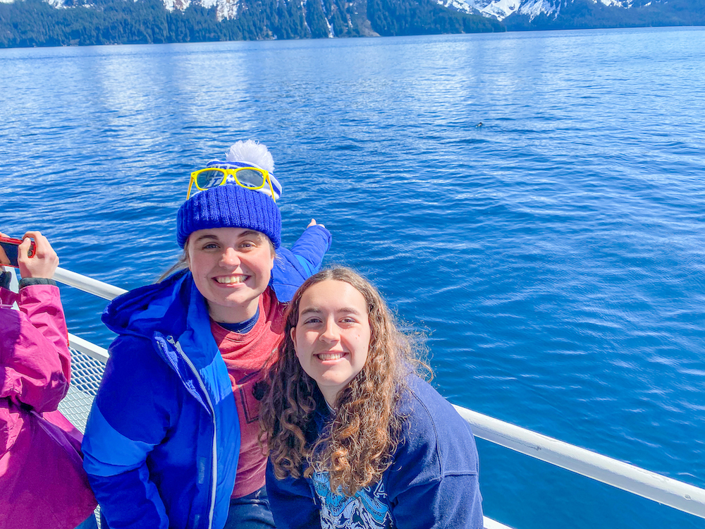 two LCU students enjoy being on the ocean in Alaska