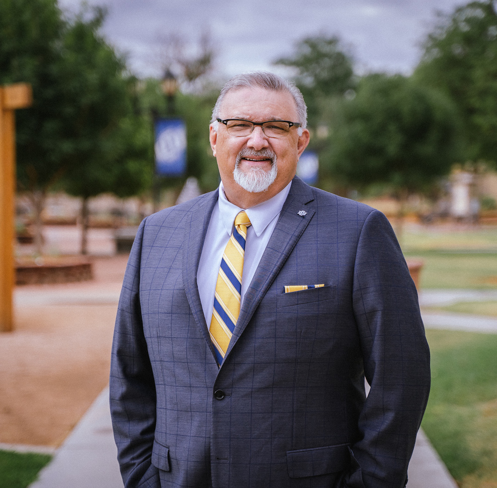 Dr. Kent Gallaher, LCU's new Provost, poses for a headshot in a suit on LCU's campus