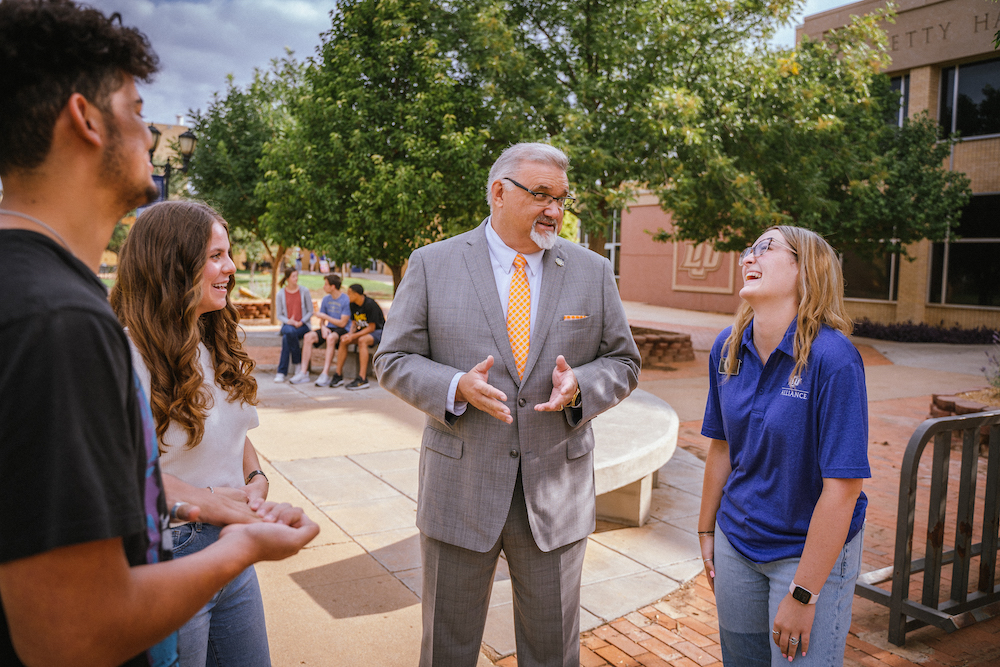 Dr. Gallaher speaks with excited students as the fall semester begins