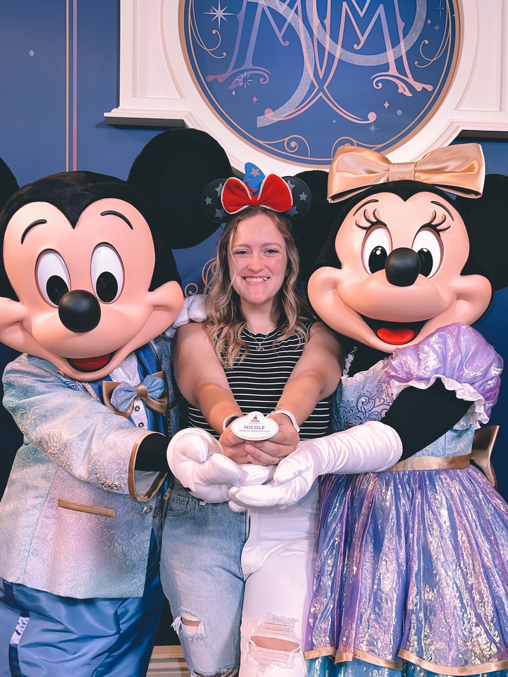 Nicole poses with Mickey and Minnie Mouse at Walt Disney World