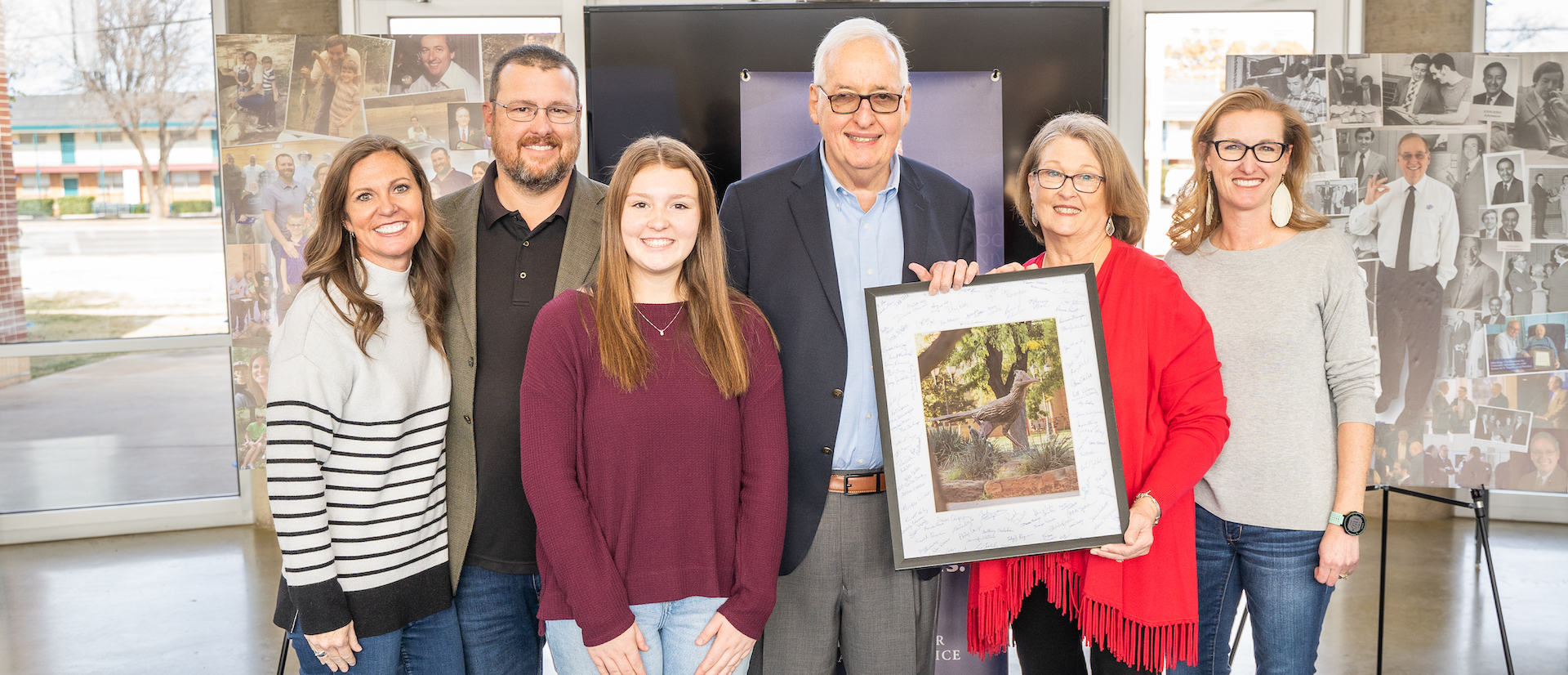 John King with his family holding commemorative photo