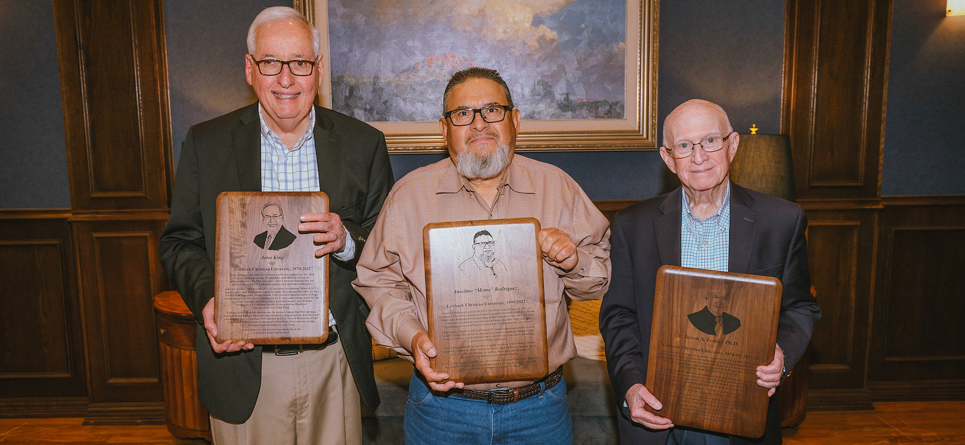 John King, "Memo", and Steven Lemley holding their retirement plaques