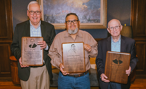 John King, "Memo", and Steven Lemley standing with their retirement plaques