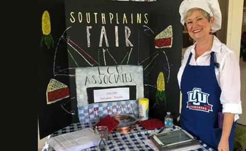 A LCU Associate selling pies at the southplains fair