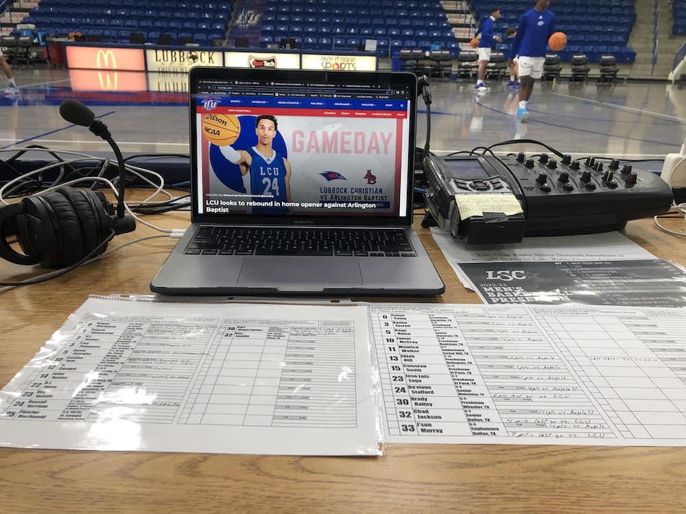 a table with the technology setup for calling a game