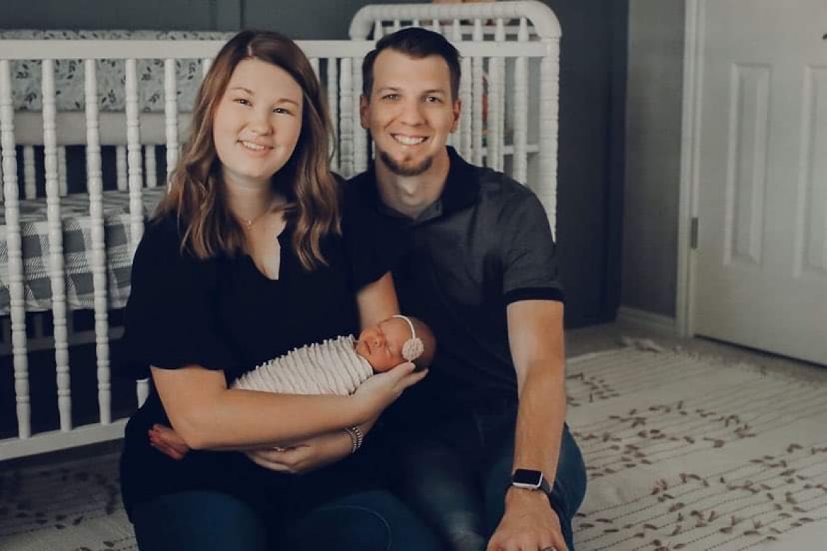 John, his wife, and their new daughter