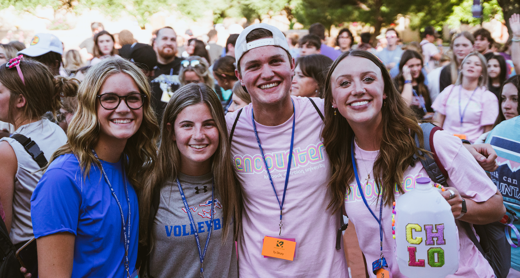 4 camp counselors taking a photo.