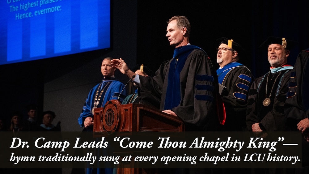 Dr. Camp leads a song during opening chapel