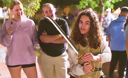 Student dressed in costume for writing carnival with a sword