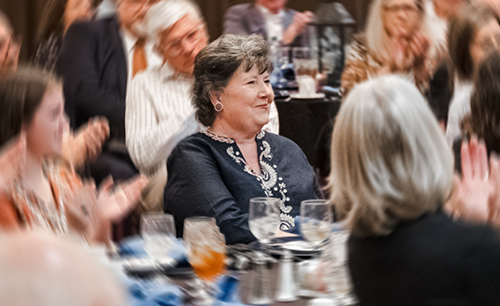 Laurie Doyle sitting at a table