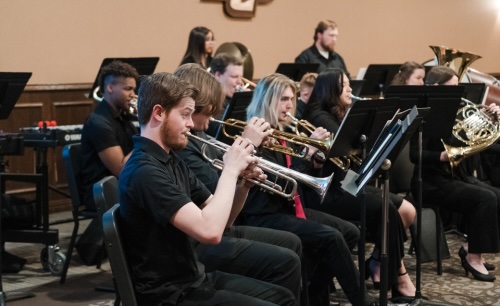 Students playing instruments in the baker conference center