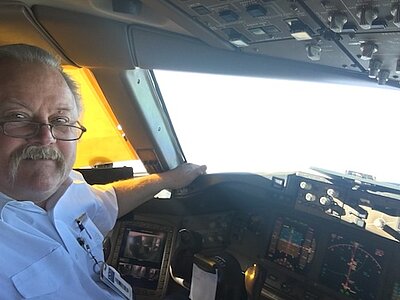 Mark in a airplane cockpit