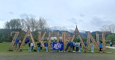 LCU Students around a city name sculpture, ZAKOPANE