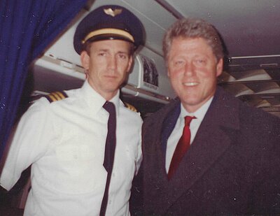Photograph of Tim with President Bill Clinton on his plane