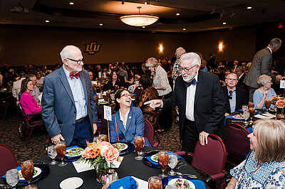 Don sharing stories with friends before the his dinner