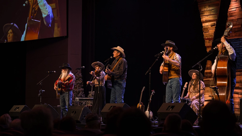 Flying J Wranglers singing on stage