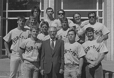 black and white photo of sub-t members standing around FW Mattox outside of the mcdonald moody