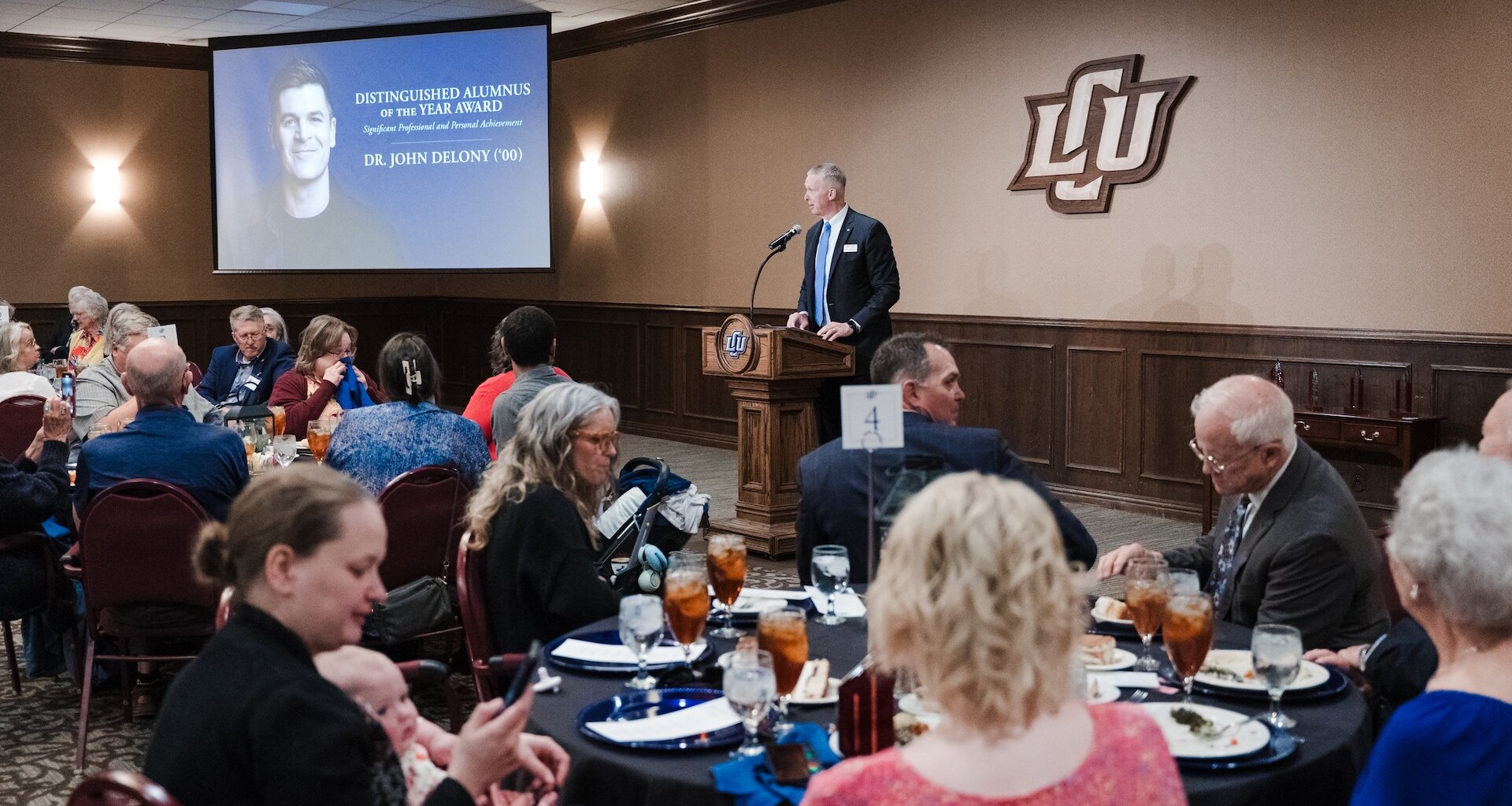 President McDowell speaking at the alumni awards dinner in the baker