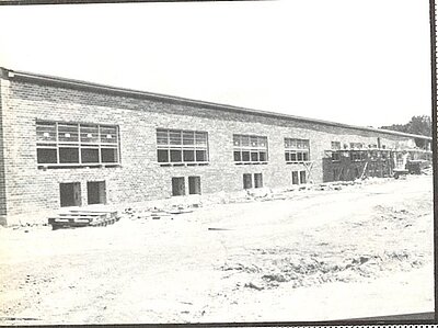 an old black and white photo of school building