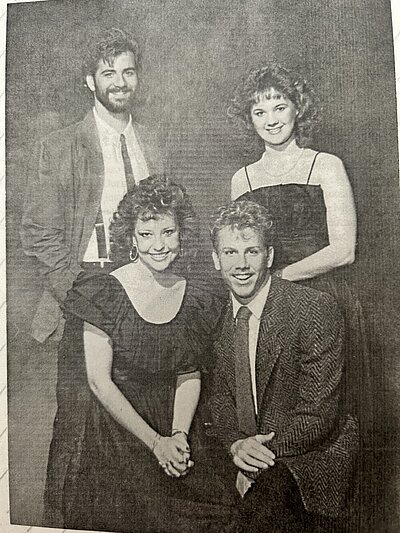 black and white yearbook photo of 1980s group of hosts