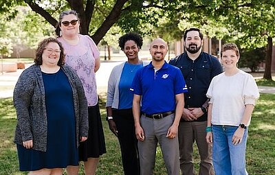 All the CSS team members posing outside in a group