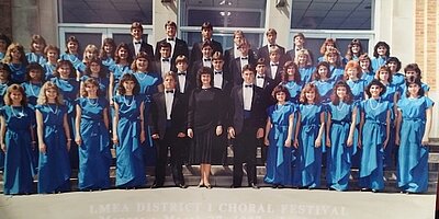 Group shot of the 1987 choir outside on steps