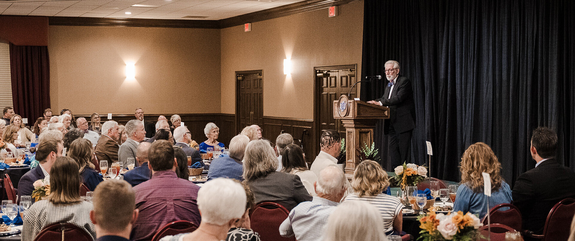 Don addressing the audience at his dinner