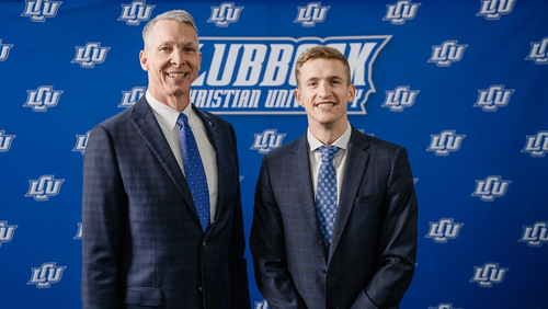 President McDowell stands next to Andrew Sorells