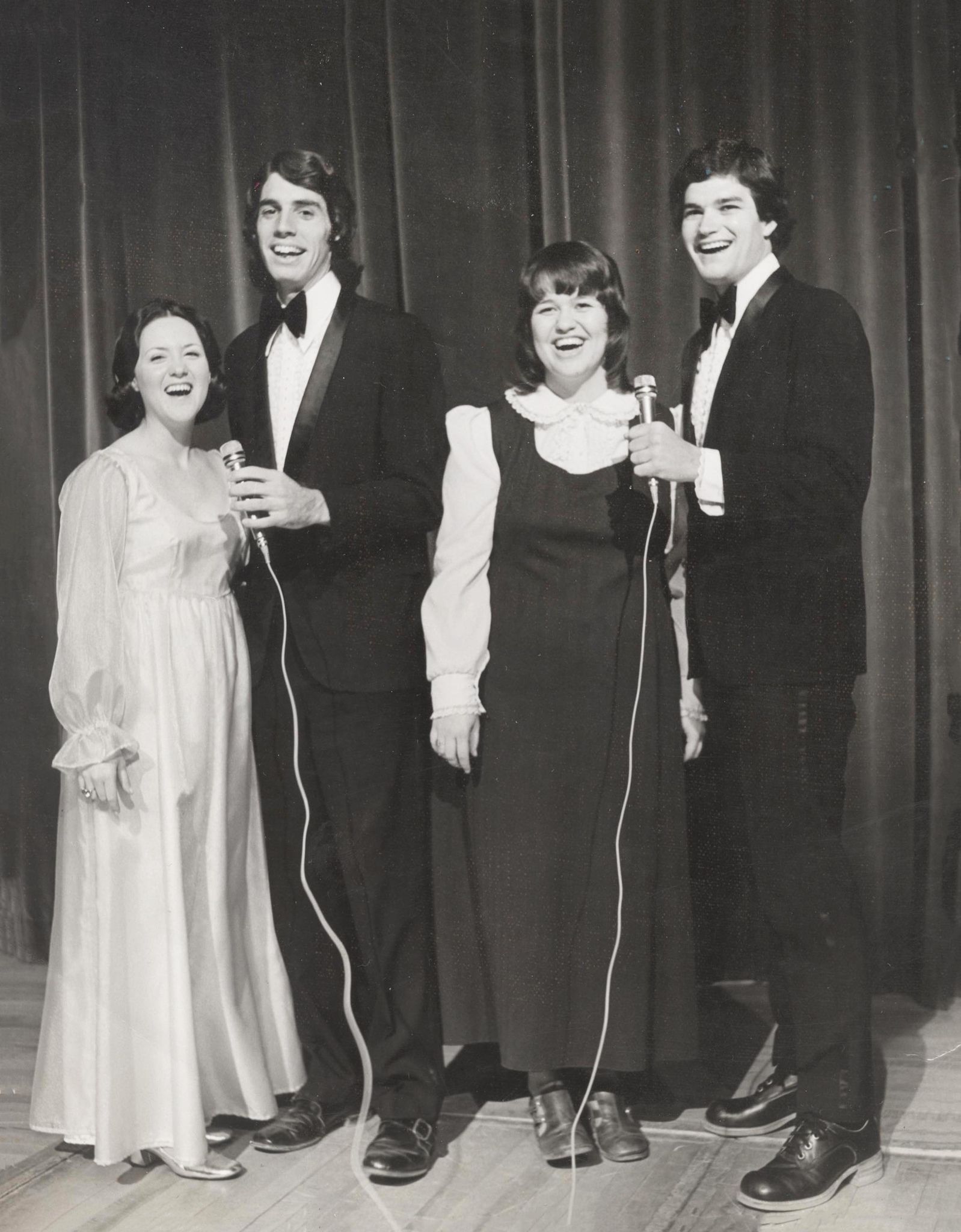 black and white photograph of the first group of hosts and hostesses