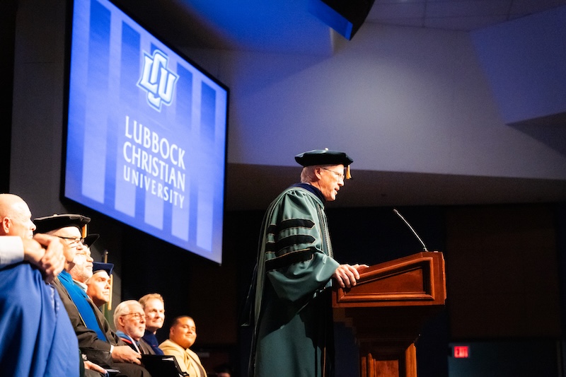 Photograph of Dr. Patty at the lecture wearing academic regalia during LCU's opening chapel