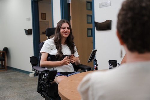 Brooklyn Boyer sitting around a table in the CSS area