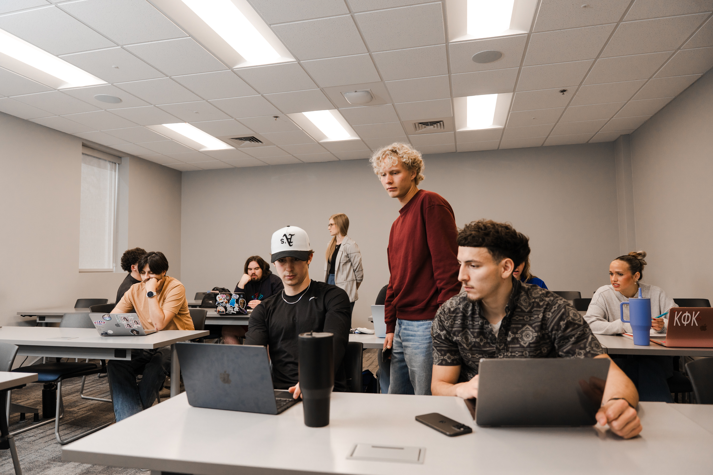 students working at their computers in a classroom