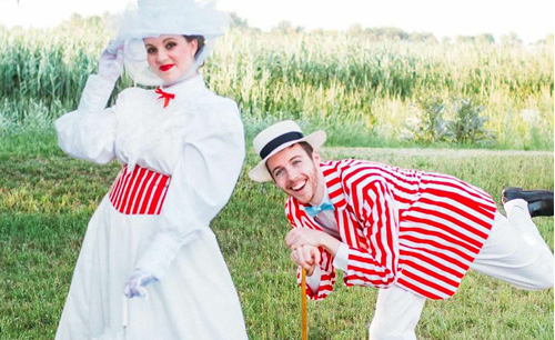 Kyle and Devon Bullock dressed up in white in red for a promotion of a show.