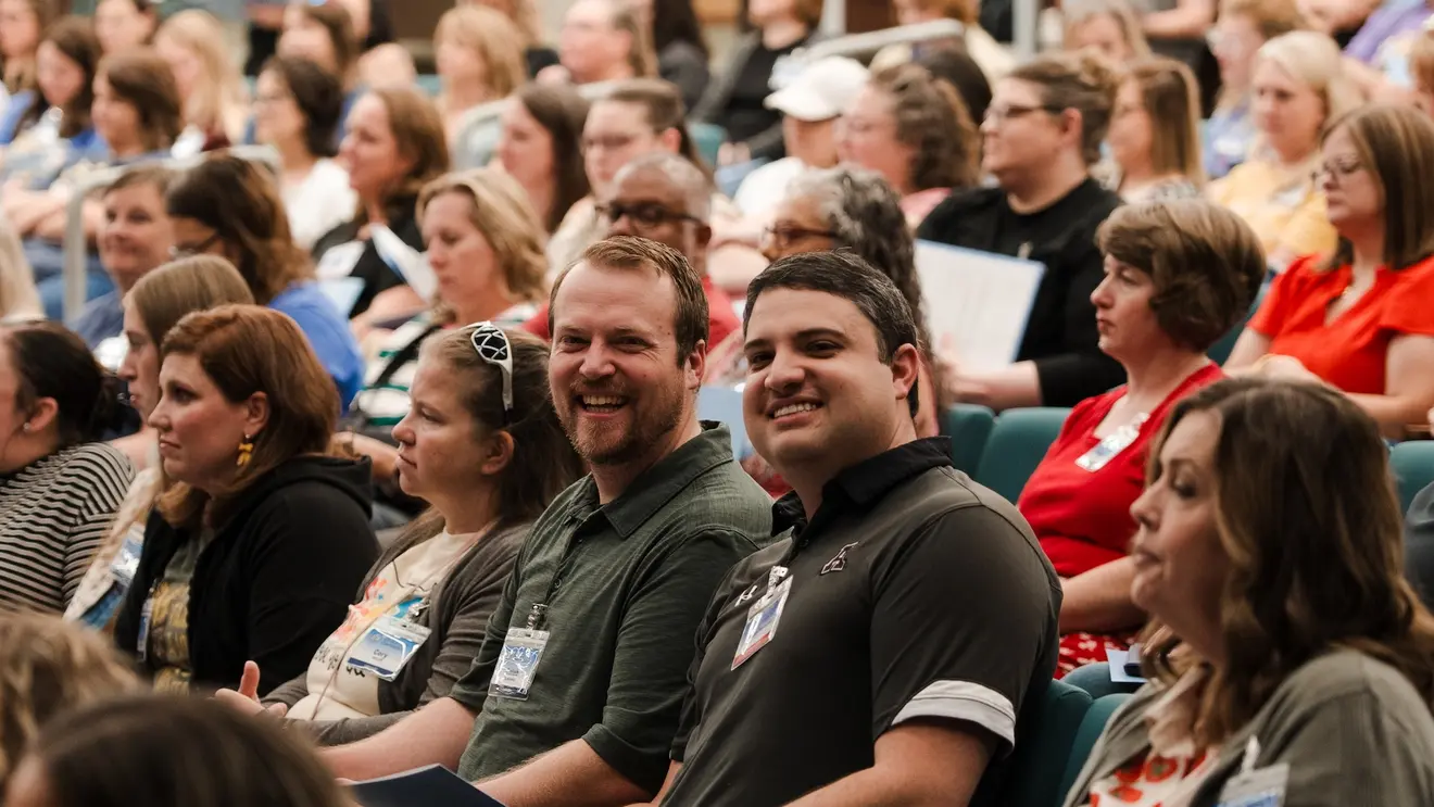 Attendees sitting in the audience at the conference