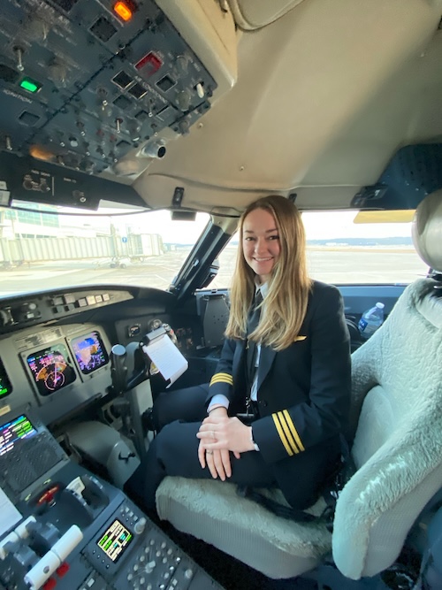 Jade in the copilots seat in airline