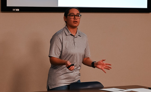 Student presenting in front of class