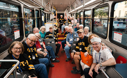 Several Sub T members riding on a city bus