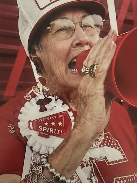 Jean Wynn cheering at a Cohoama game