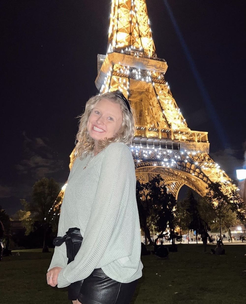 Alexis posing in front of the Eiffel Tower in Paris
