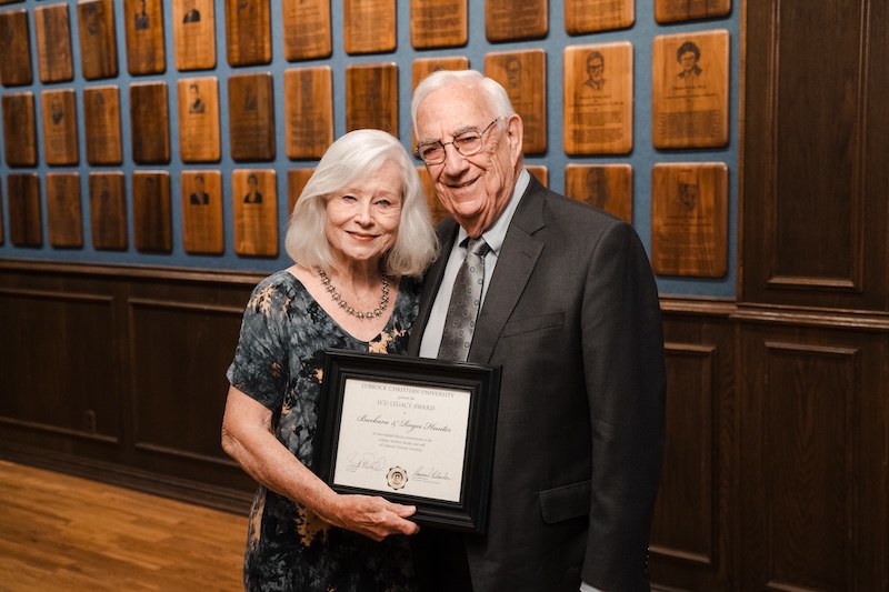 Barbara and Royce Hunter posing with their award