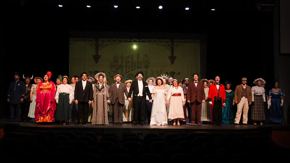 The cast on stage at end of Hello Dolly production
