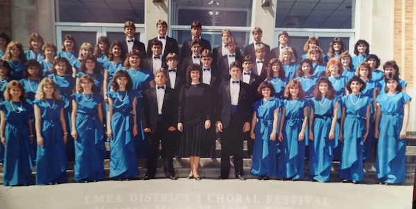 Group shot of the 1987 choir outside on steps