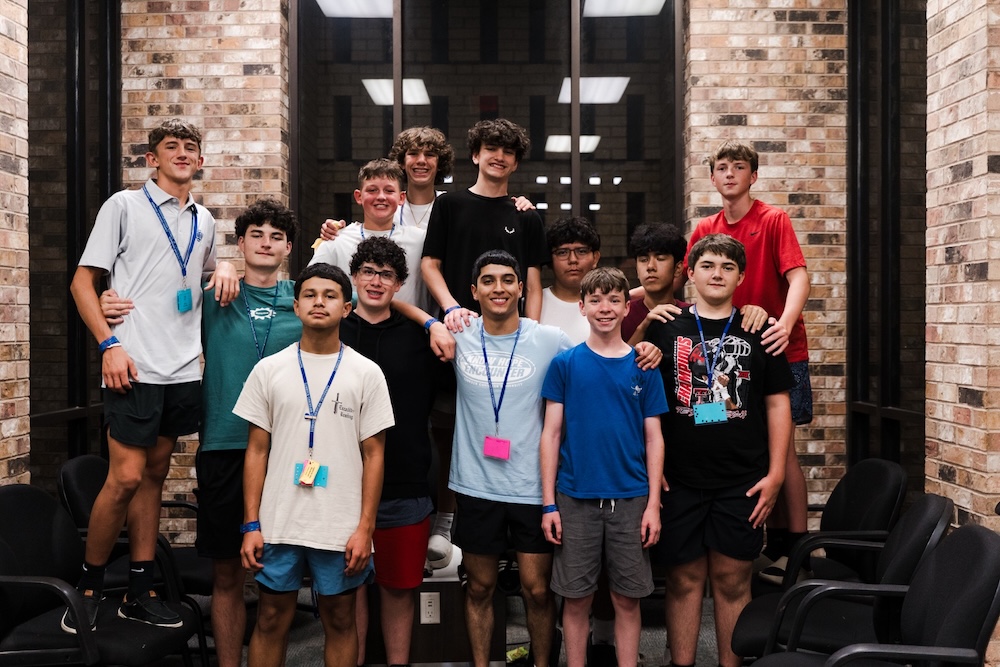 Counselor Gabriel Montalvo poses with a group of campers during LCU Summer Camps.